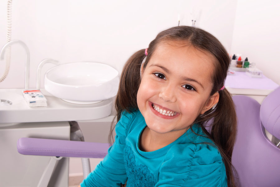 Young girl in the dental chair.